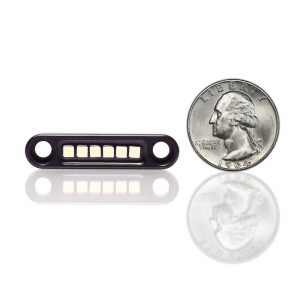 Black cable lock for security, compact design, durable construction, perfect for small devices or accessories.